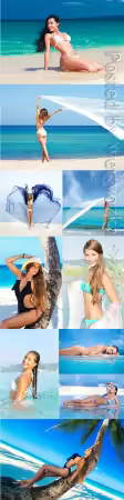 Girls in swimsuits on the seashore stock photo