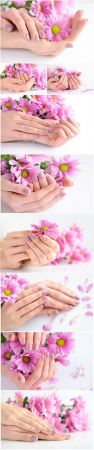 Beautiful manicure, hands with flowers