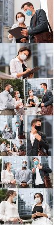 Colleagues chat outdoors during pandemic with face masks